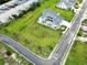 Aerial view of a home in a neighborhood, with a yard, three-car garage, and a road at 607 Boone Hall Dr., Myrtle Beach, SC 29579