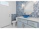 Bathroom featuring eye-catching blue tile, a vessel sink, and modern fixtures at 607 Boone Hall Dr., Myrtle Beach, SC 29579