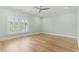 Spacious bedroom featuring natural light, hardwood floors, and a ceiling fan at 607 Boone Hall Dr., Myrtle Beach, SC 29579