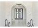 Elegant entryway with brick archway, double doors, and decorative lanterns at 607 Boone Hall Dr., Myrtle Beach, SC 29579