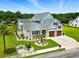 Stunning, professionally landscaped home with three-car garage, and well-manicured lawn at 607 Boone Hall Dr., Myrtle Beach, SC 29579