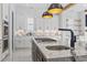 Kitchen island with granite countertop and marble backsplash. Stainless steel appliances throughout at 607 Boone Hall Dr., Myrtle Beach, SC 29579