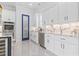 Beautiful kitchen with stainless steel appliances, and white cabinets. Granite backsplash throughout at 607 Boone Hall Dr., Myrtle Beach, SC 29579