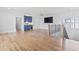 Living room with wood flooring, custom bar area and staircase at 607 Boone Hall Dr., Myrtle Beach, SC 29579