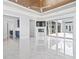 Bright living room features tray ceilings, fireplace, and sliding glass doors to the outdoor pool area at 607 Boone Hall Dr., Myrtle Beach, SC 29579