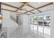 Bright open living room with high ceilings, fireplace, marble floors, and access to patio at 607 Boone Hall Dr., Myrtle Beach, SC 29579