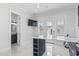 Bright office space featuring marble floors, white walls, a built-in desk, and French doors leading to the outdoor area at 607 Boone Hall Dr., Myrtle Beach, SC 29579
