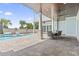 Backyard patio featuring a pool, fountain features, and outdoor dining area at 607 Boone Hall Dr., Myrtle Beach, SC 29579