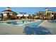 A long rectangular pool with lounge chairs and palm trees around it at the community center at 607 Boone Hall Dr., Myrtle Beach, SC 29579