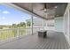 Spacious porch featuring a ceiling fan, pillars, outdoor seating, and a view at 607 Boone Hall Dr., Myrtle Beach, SC 29579