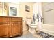 Cozy bathroom with a vanity, toilet, and tub with decorative shower curtain at 6172 Catalina Dr. # 113, North Myrtle Beach, SC 29582