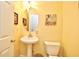Cozy powder room featuring pedestal sink, framed art, and neutral color palette at 6172 Catalina Dr. # 113, North Myrtle Beach, SC 29582