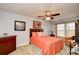 Comfortable bedroom featuring a ceiling fan, warm colors, and natural light from the window at 6172 Catalina Dr. # 113, North Myrtle Beach, SC 29582