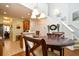 Cozy dining area with wood table, adjacent to the kitchen and stairs at 6172 Catalina Dr. # 113, North Myrtle Beach, SC 29582