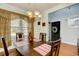 Cozy dining room with a wooden table set for four and a view of the front entrance at 6172 Catalina Dr. # 113, North Myrtle Beach, SC 29582