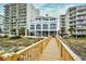 Beachfront condo with a wooden boardwalk, surrounded by dunes and ocean views at 6172 Catalina Dr. # 113, North Myrtle Beach, SC 29582