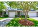 Inviting two-story townhome with attached garage, balcony, and beautiful, lush front lawn at 6172 Catalina Dr. # 113, North Myrtle Beach, SC 29582