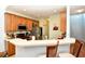 Well-lit kitchen with stainless steel appliances, breakfast bar and light countertops at 6172 Catalina Dr. # 113, North Myrtle Beach, SC 29582