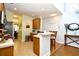Charming kitchen features light countertops and a breakfast bar with seating at 6172 Catalina Dr. # 113, North Myrtle Beach, SC 29582