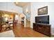 Bright living room flowing into the dining area with stairs and an open floor plan at 6172 Catalina Dr. # 113, North Myrtle Beach, SC 29582