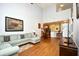 Open-concept living space with sofa, television, and stairs to the second floor at 6172 Catalina Dr. # 113, North Myrtle Beach, SC 29582