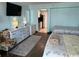 Inviting bedroom with two beds, modern furniture, and a view of the kitchen at 6900 Ocean Blvd. N # 303, Myrtle Beach, SC 29572