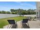 An outdoor patio features lounge chairs, a table with chairs, a grill, and a trampoline at 729 Bonita Loop, Myrtle Beach, SC 29588