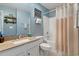 Well-lit bathroom features a granite-topped vanity and shower-tub combo, with attractive decor at 729 Bonita Loop, Myrtle Beach, SC 29588