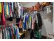 A walk-in closet is stocked with clothing and accessories on shelves and rods at 729 Bonita Loop, Myrtle Beach, SC 29588