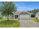 Charming single-Gathering home features a manicured lawn, two-car garage, and beautiful landscaping at 729 Bonita Loop, Myrtle Beach, SC 29588
