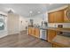 Spacious kitchen features stainless steel appliances, wood cabinetry, and modern flooring at 729 Bonita Loop, Myrtle Beach, SC 29588