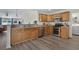 The kitchen features wood cabinets, stainless steel appliances, and an open layout at 729 Bonita Loop, Myrtle Beach, SC 29588