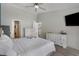 The main bedroom has hardwood floors, a ceiling fan, and two dressers at 729 Bonita Loop, Myrtle Beach, SC 29588