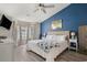 This main bedroom has a bay window, a ceiling fan, and an accent wall at 729 Bonita Loop, Myrtle Beach, SC 29588