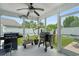Covered porch features grilling area with ceiling fan overlooking the private backyard at 729 Bonita Loop, Myrtle Beach, SC 29588