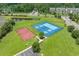 Aerial view featuring community tennis and basketball courts, plus pond and wooded areas at 729 Bonita Loop, Myrtle Beach, SC 29588