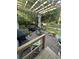 Relaxing backyard patio with a pergola, outdoor seating, and lush greenery at 814 James Landing Ct., Murrells Inlet, SC 29576