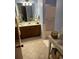 Spacious bathroom featuring a vanity with wood cabinets and a shower over tub at 814 James Landing Ct., Murrells Inlet, SC 29576