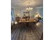 The dining room has wood floors, a table with chairs, and a decorative chandelier at 814 James Landing Ct., Murrells Inlet, SC 29576