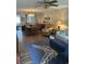 Bright living room featuring hardwood floors, a ceiling fan, and dining area at 814 James Landing Ct., Murrells Inlet, SC 29576