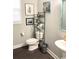 Well-lit bathroom with a toilet, shelving, a sink with mirror, and artwork at 821 Falkirk St., Myrtle Beach, SC 29579