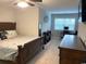 Comfortable bedroom with a ceiling fan, study desk, and neutral tones provides a calm space at 821 Falkirk St., Myrtle Beach, SC 29579