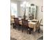 Traditional dining room featuring a light fixture, beige rug, and seating for six at 821 Falkirk St., Myrtle Beach, SC 29579