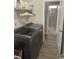 Updated laundry room with modern washer and dryer units plus a view into the bathroom at 821 Falkirk St., Myrtle Beach, SC 29579