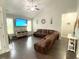 Spacious living room with hardwood floors, a vaulted ceiling, and a comfortable leather sectional sofa at 821 Falkirk St., Myrtle Beach, SC 29579