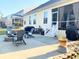 Outdoor patio area with lounge chairs, a fire pit, a covered grill, and an outdoor dining space at 821 Falkirk St., Myrtle Beach, SC 29579