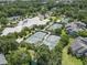 Overhead shot of community tennis courts, swimming pool and clubhouse surrounded by mature trees and greenery at 824 Castleford Circle # 7C, Myrtle Beach, SC 29572