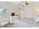 Bright bedroom features a dresser, TV, chair and a window at 824 Castleford Circle # 7C, Myrtle Beach, SC 29572