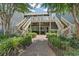 Exterior entrance featuring a walkway, stairs, and well-maintained landscaping at 824 Castleford Circle # 7C, Myrtle Beach, SC 29572