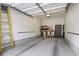 Empty garage featuring concrete floor, shelving, and interior access door at 824 Castleford Circle # 7C, Myrtle Beach, SC 29572